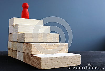 Ladder of success from wooden blocks. Ambitions and achievements Stock Photo