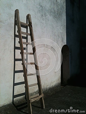 Ladder in the wall Stock Photo