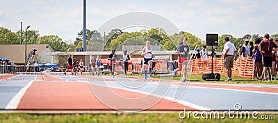 Ladies Compete in 1600 Meter Race at Invitational Editorial Stock Photo