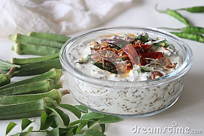 Ladies finger raita or Vendaka kichadi. A yogurt based side dish for traditional Kerala meals. Crisp fried ladies finger in thick Stock Photo