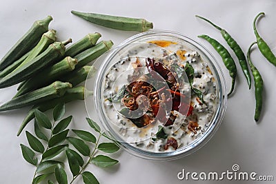 Ladies finger raita or Vendaka kichadi. A yogurt based side dish for traditional Kerala meals. Crisp fried ladies finger in thick Stock Photo