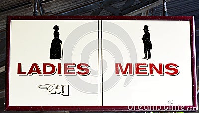 Ladies and Mens restrooms sign Stock Photo