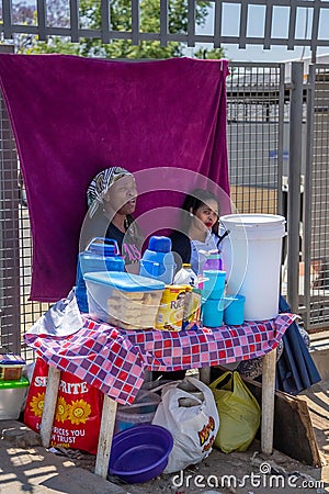 Ladies selling coffee and rusks from road side stall Editorial Stock Photo