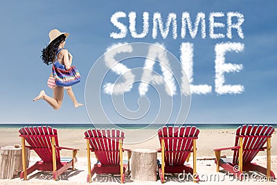 Lady at beach with summer sale cloud Stock Photo