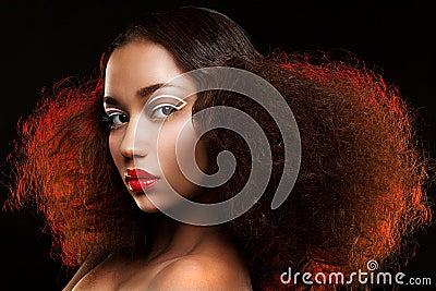 Lady with beautiful hairstyle and unusual makeup Stock Photo