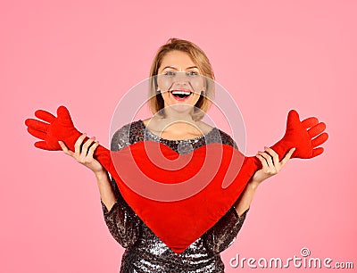 Lady with blond hair puts hearts hands aside. Stock Photo