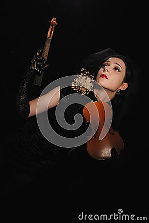 Lady with the broken violin Stock Photo