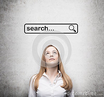 Lady and a concept of a browsing in the Internet. Searching line are drawn on the concrete wall above the lady. Stock Photo