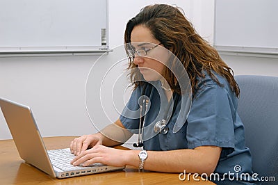 Lady doctor working with the notebook Stock Photo