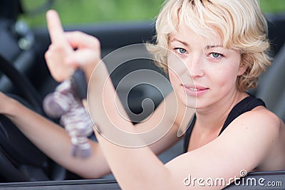 Lady, driving showing car keys out the window. Stock Photo