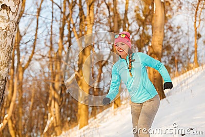 Lady exercising in winter Stock Photo