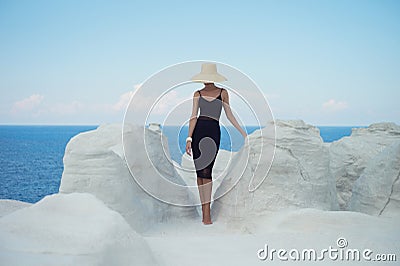 Lady in hat in an unusual landscape Stock Photo