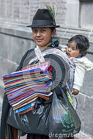 A lady with her child selling textiles at Independence Square in Quito in Ecuador in South America. Editorial Stock Photo