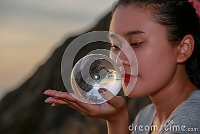 View of sunset inside crystal ball Stock Photo