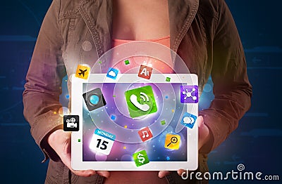 Lady holding a tablet with modern colorful apps and icons Stock Photo