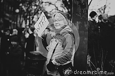 Lady holding WTF? protesting poster Editorial Stock Photo