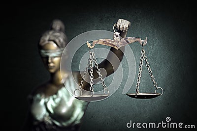 Lady Justice on emerald background Stock Photo