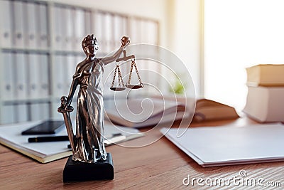 Lady Justice statue in law firm office Stock Photo