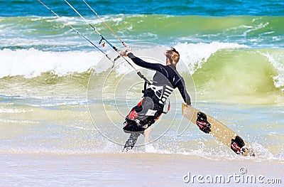 Lady Kite boarder entering the surf Editorial Stock Photo
