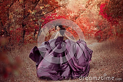 Lady in a luxury lush purple dress Stock Photo