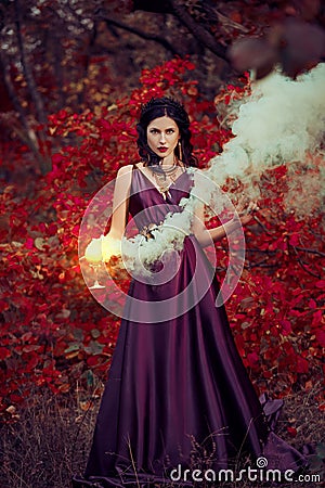 Lady in a luxury lush purple dress Stock Photo