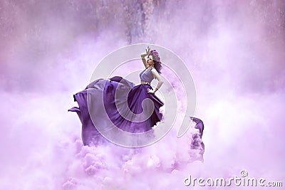 Lady in a luxury lush purple dress Stock Photo