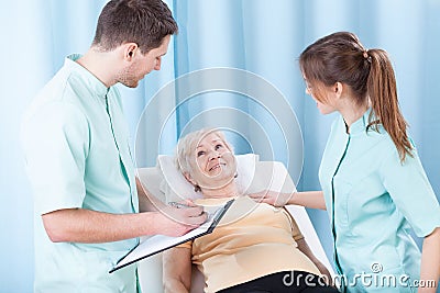 Lady lying on hospital bed Stock Photo