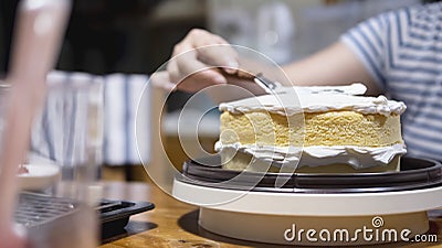 Lady making cream cake Stock Photo