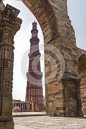 Lady passing through courtyard in Qutub complex in Mehrauli. Editorial Stock Photo