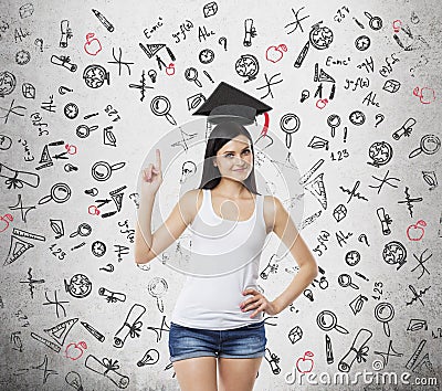 Lady is presents a necessity of higher education. Graduation hat above her head. Educational icons are drawn over the con Stock Photo