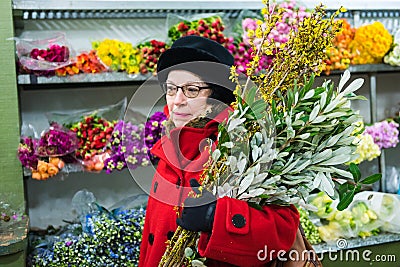 Lady in Red - Chelsea Flower Market - New York City Editorial Stock Photo