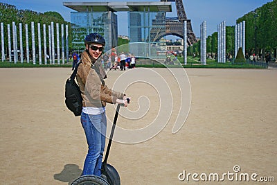 Lady riding a Segway machine in Paris Editorial Stock Photo