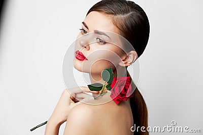Lady with rose bright Look aside the makeup Stock Photo