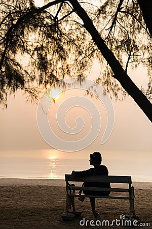 Lady at Sunset on the Beach Stock Photo