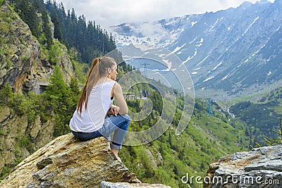 Lady tourist on mountain Stock Photo