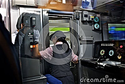 A lady train driver in Tokyo subway. Editorial Stock Photo