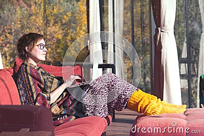 Lady in travel Style Clothing using Computer at Hotel Lobby Stock Photo