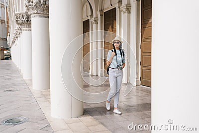 Lady walking in the Greek style building Stock Photo