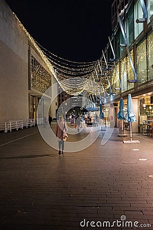 A lady walking in Southbank. New year decorations in Southbank. Editorial Stock Photo