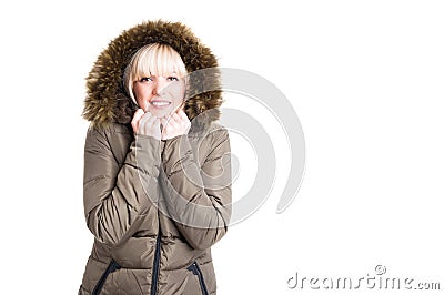 Lady wearing winter jacket with hood being cold Stock Photo