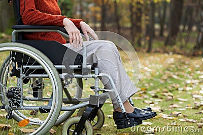 Lady on wheelchair in the forest Stock Photo