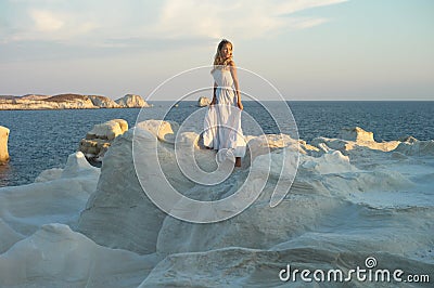 Lady in white dress in an unusual landscape Stock Photo