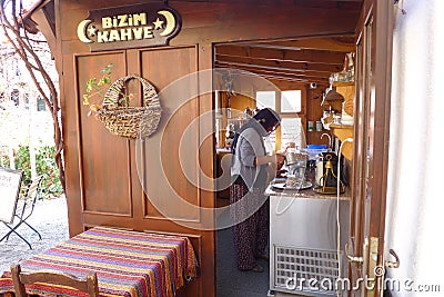 The lady who makes coffee in her authentic clothes in BeypazarÄ± Goynuk, her face is not visible Editorial Stock Photo