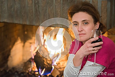 Lady, wine, fireplace Stock Photo