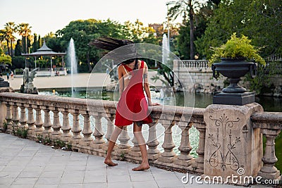 Ladyboy tattooed transgender model is dancing in the green park Stock Photo