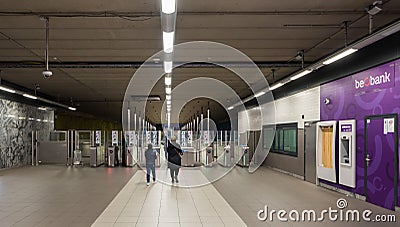 Laeken, Brussels Capital Region - Belgium - Maghreb people walking to the ticket control gates of the local Bockstael metro Editorial Stock Photo