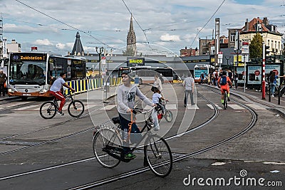 Laeken, Brussels Capital Region - Belgium - Young migrant children driving the bicycle at the Bockstael Avenue during the Car Free Editorial Stock Photo