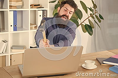 Lagging system. Hate office routine. Man bearded crush computer. Software license agreement. Destroy laptop. Hateful job Stock Photo