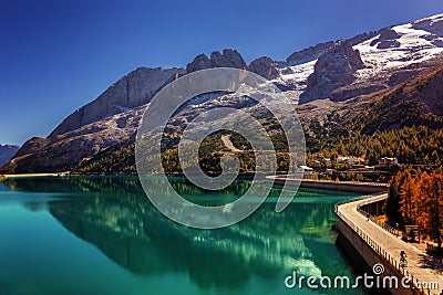 Lago Fedaia Fedaia lake, an artificial lake and a dam near Canazei city, located at the foot of Marmolada massif, as seen from Stock Photo
