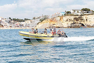 Lagoa, Portugal - July 11, 2020: A rubber duck tourist speed boat at the Benagil caves Editorial Stock Photo